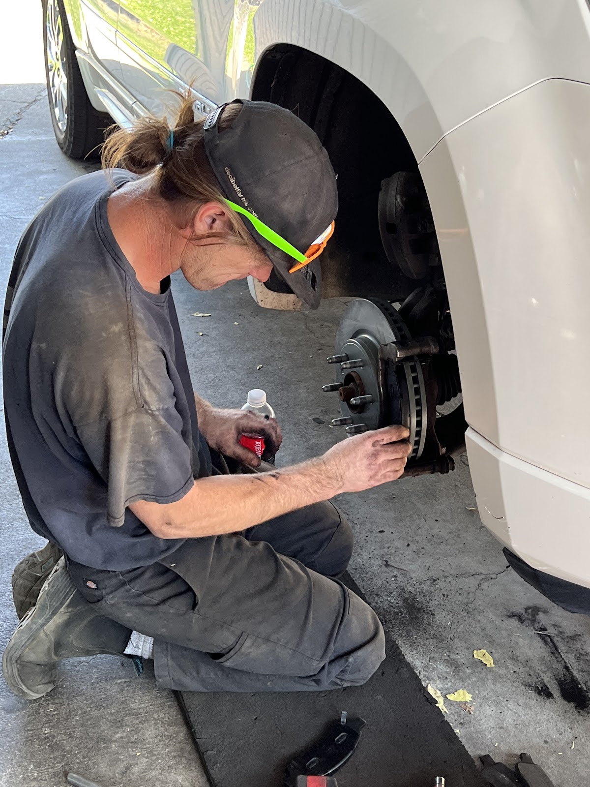 Steve performing a brake job at the wheel of a customer's vehicle